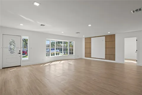 a kitchen with stainless steel appliances granite countertop a stove and a refrigerator