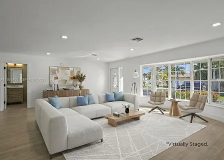 a kitchen with stainless steel appliances granite countertop a sink and stove