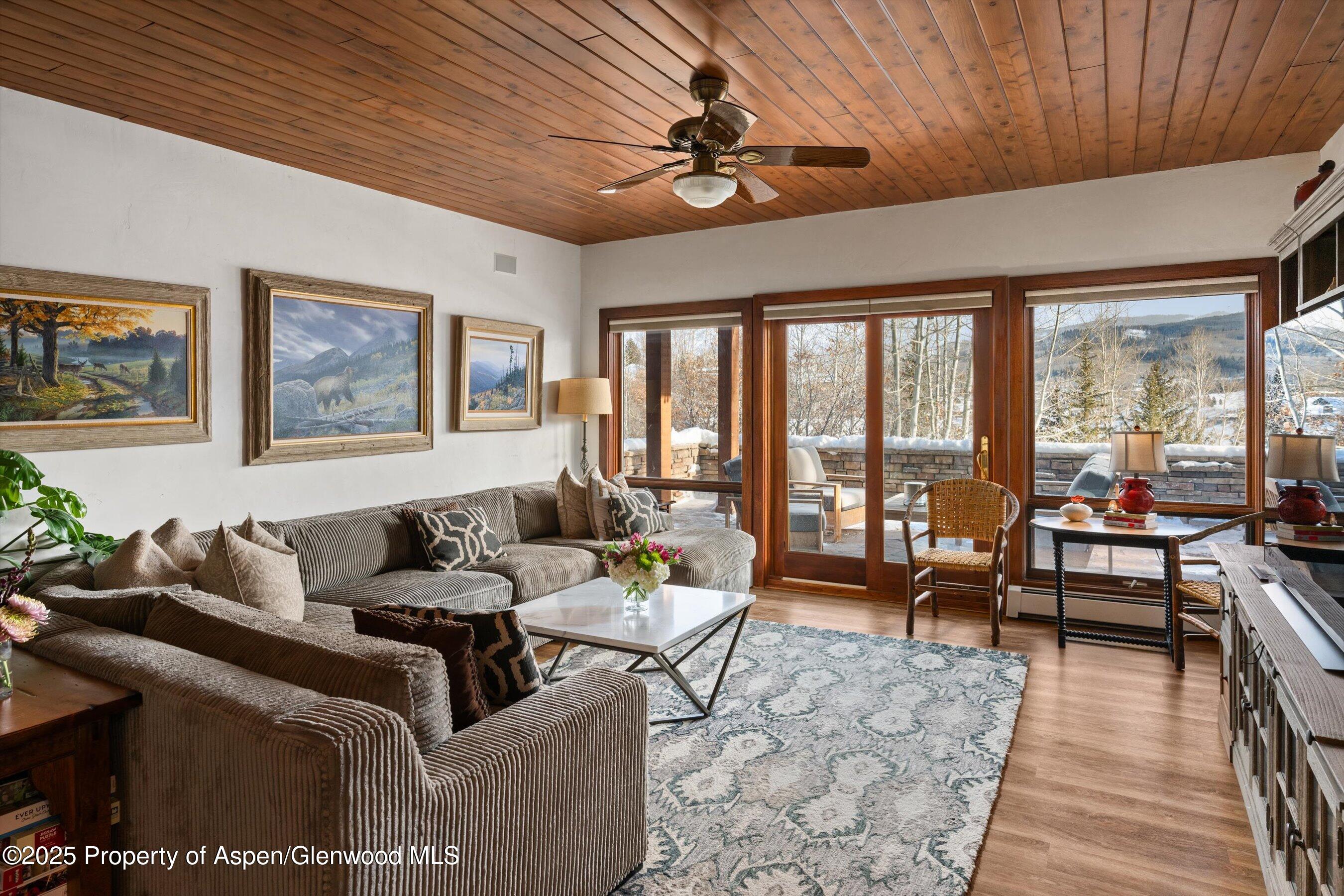 516 Sinclair Road Snowmass Village, CO 81615 - Photo 17 of 37 a living room with furniture and a large window