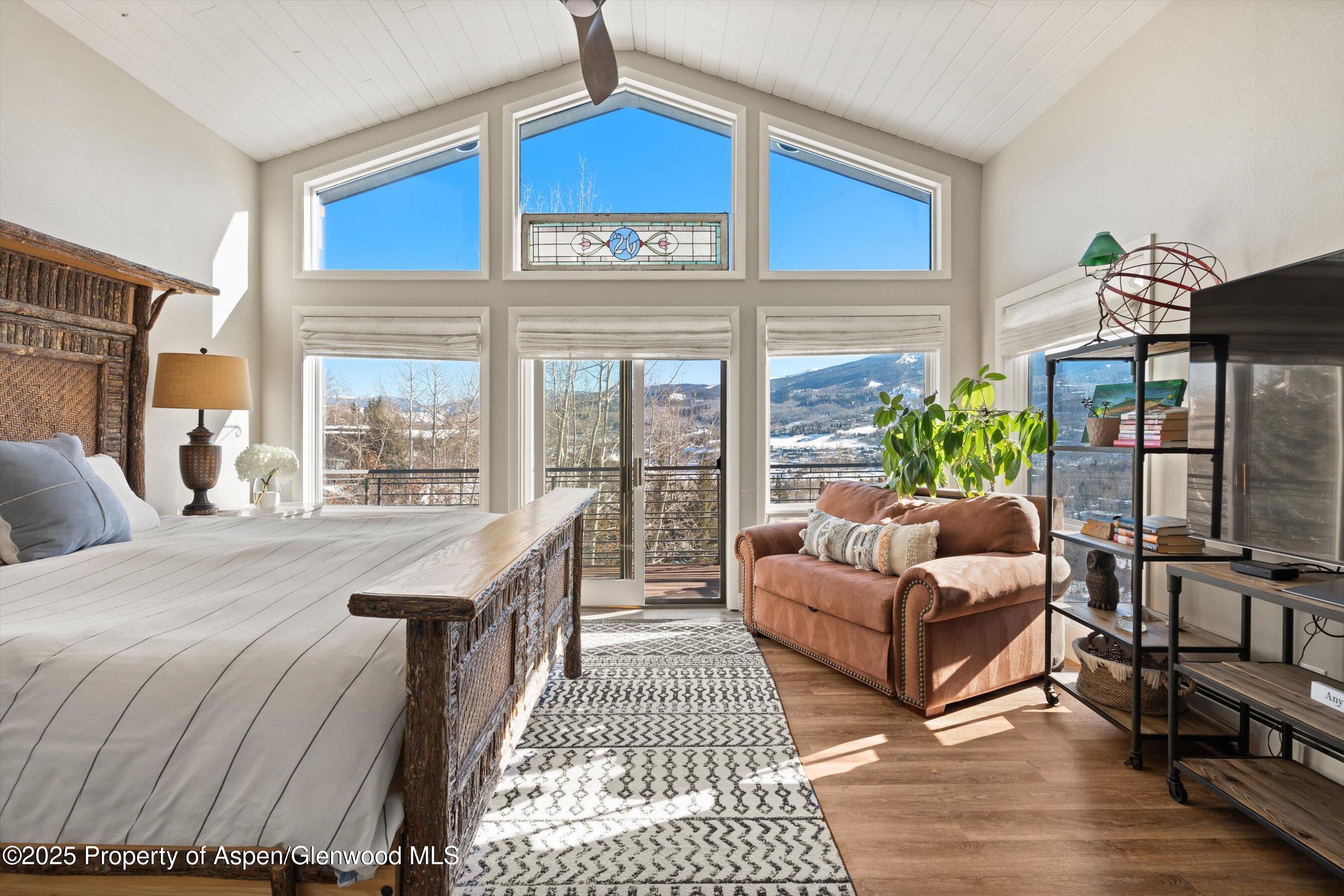 516 Sinclair Road Snowmass Village, CO 81615 - Photo 22 of 37 a living room with furniture fireplace and a large window