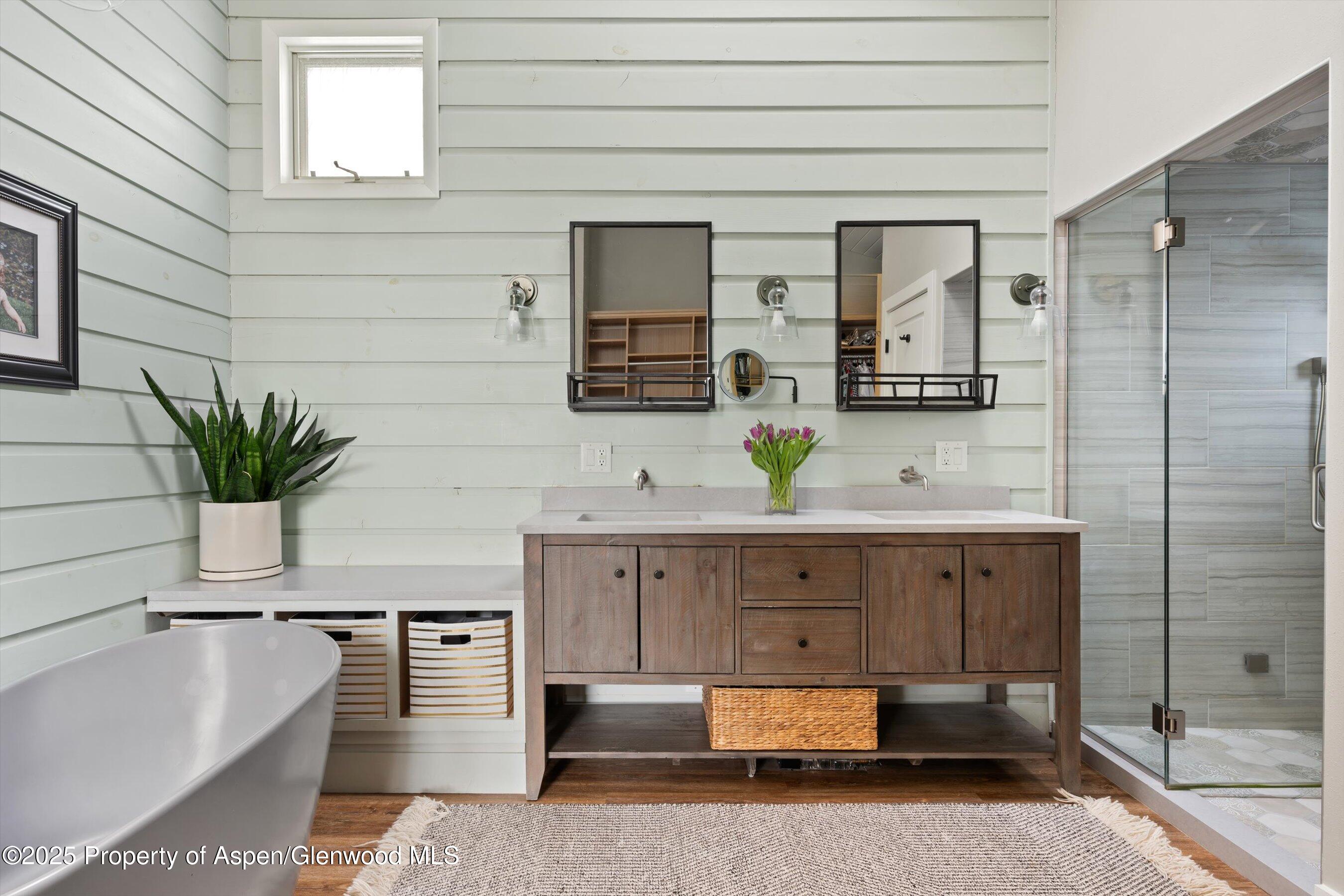 516 Sinclair Road Snowmass Village, CO 81615 - Photo 24 of 37 a spacious bathroom with a double vanity sink and a mirror