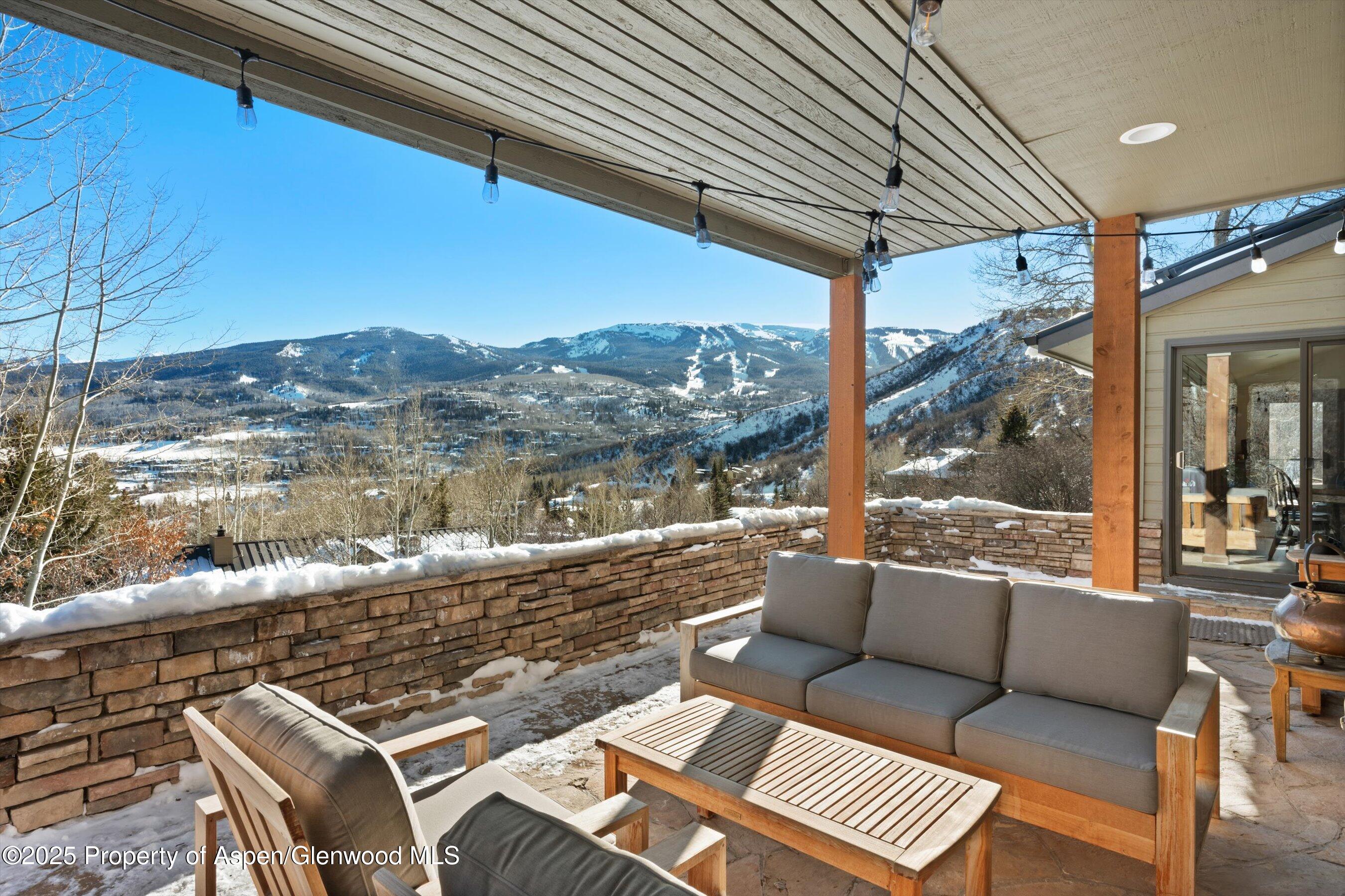 516 Sinclair Road Snowmass Village, CO 81615 - Photo 3 of 37 a roof deck with couch and outdoor view
