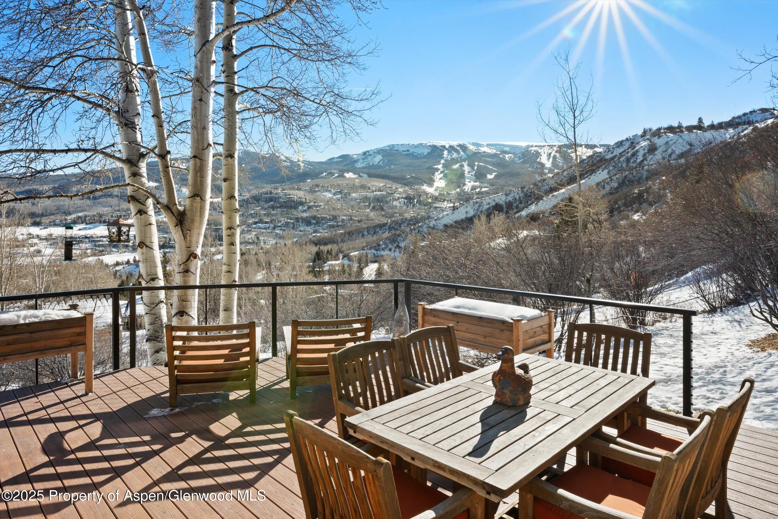 516 Sinclair Road Snowmass Village, CO 81615 - Photo 5 of 37 a view of balcony with wooden floor and outdoor seating