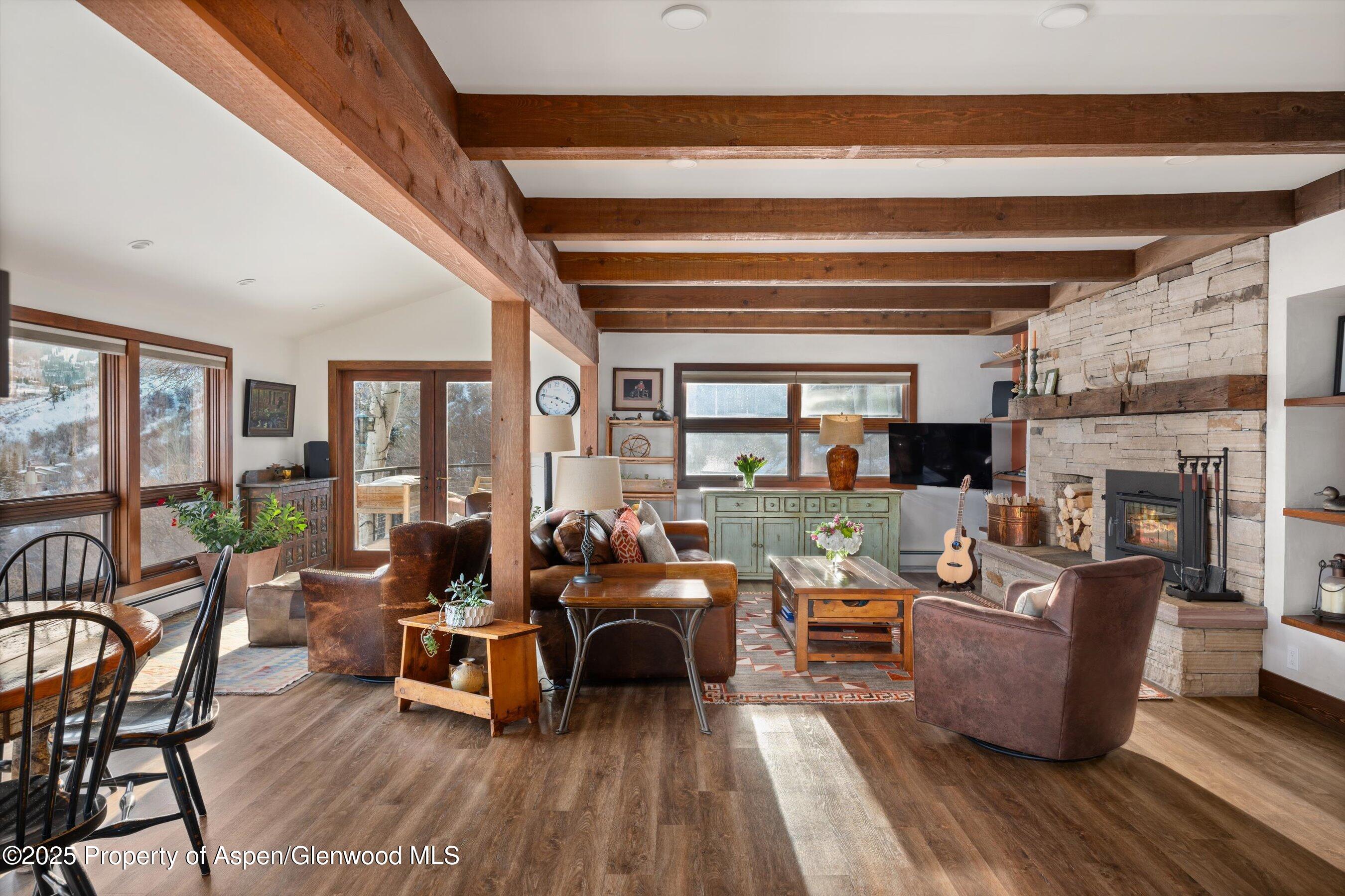 516 Sinclair Road Snowmass Village, CO 81615 - Photo 6 of 37 a living room with furniture and a fireplace
