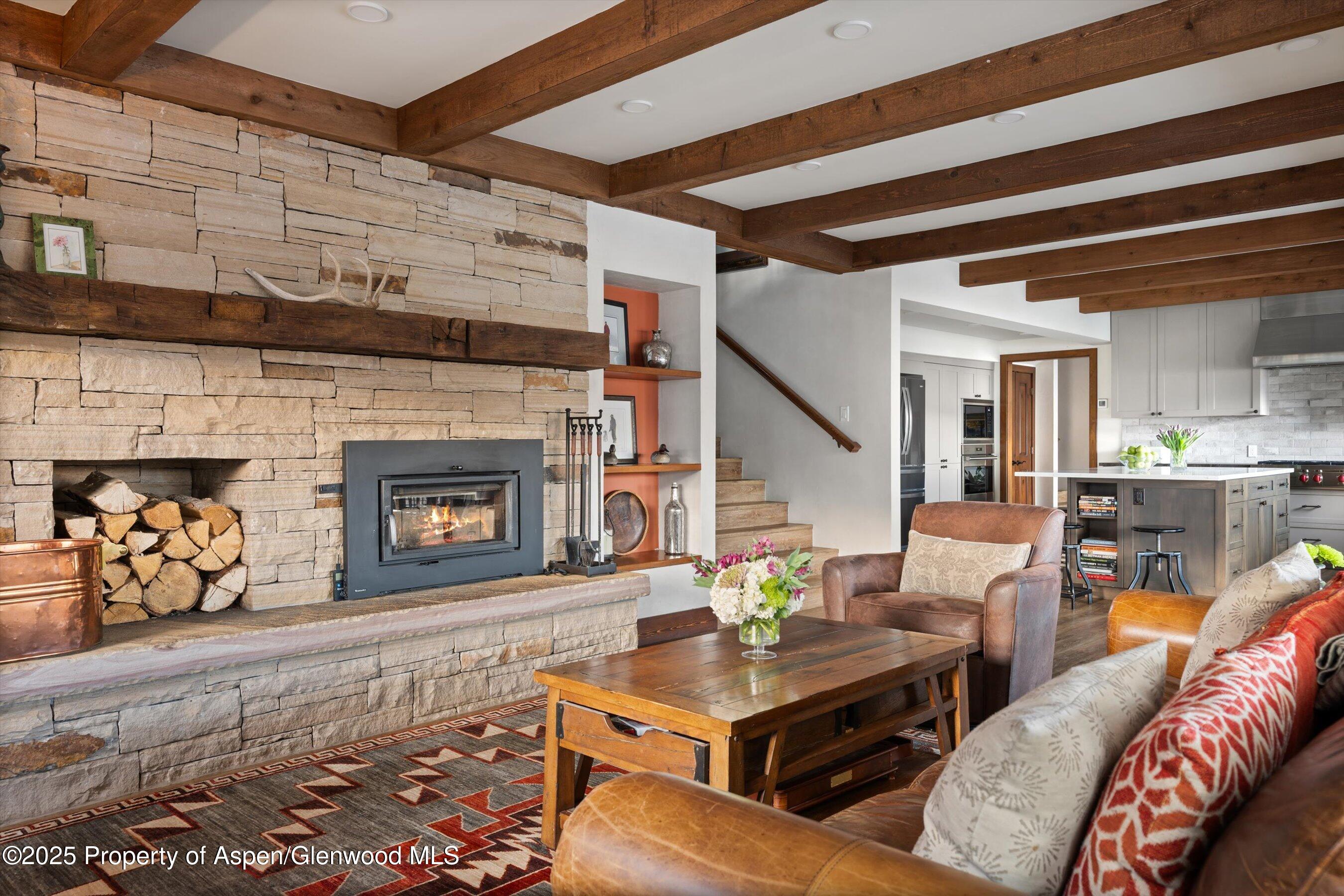 516 Sinclair Road Snowmass Village, CO 81615 - Photo 10 of 37 a living room with furniture and a fireplace