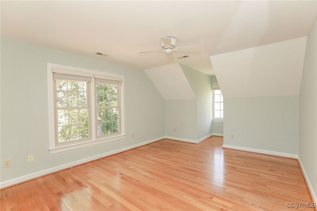 107 Muirfield Williamsburg, VA 23188 - Photo 27 of 36 a view of an empty room with wooden floor and a window