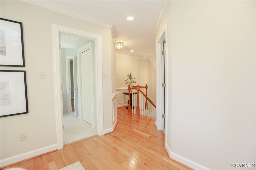 107 Muirfield Williamsburg, VA 23188 - Photo 29 of 36 a hallway with a view of bedroom with wooden floor