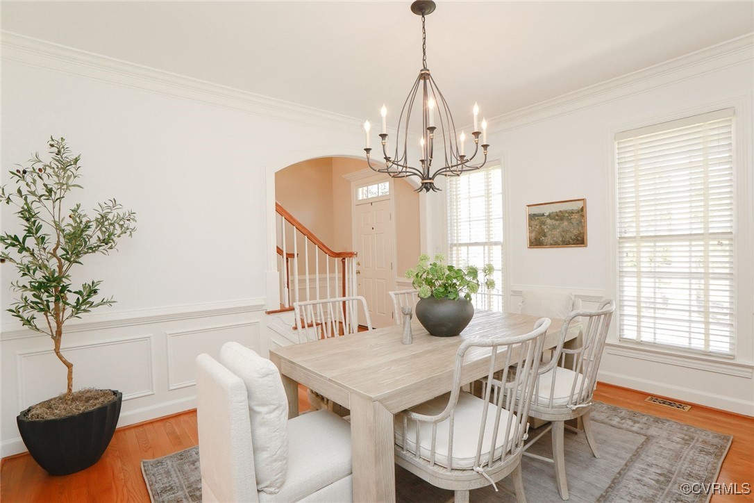 107 Muirfield Williamsburg, VA 23188 - Photo 4 of 36 a view of a dining room with furniture window and wooden floor