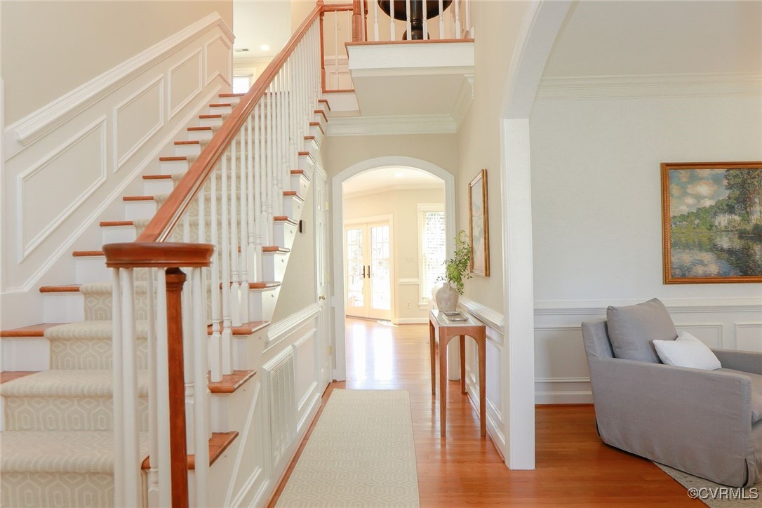107 Muirfield Williamsburg, VA 23188 - Photo 5 of 36 a living room with a large window and wooden floor