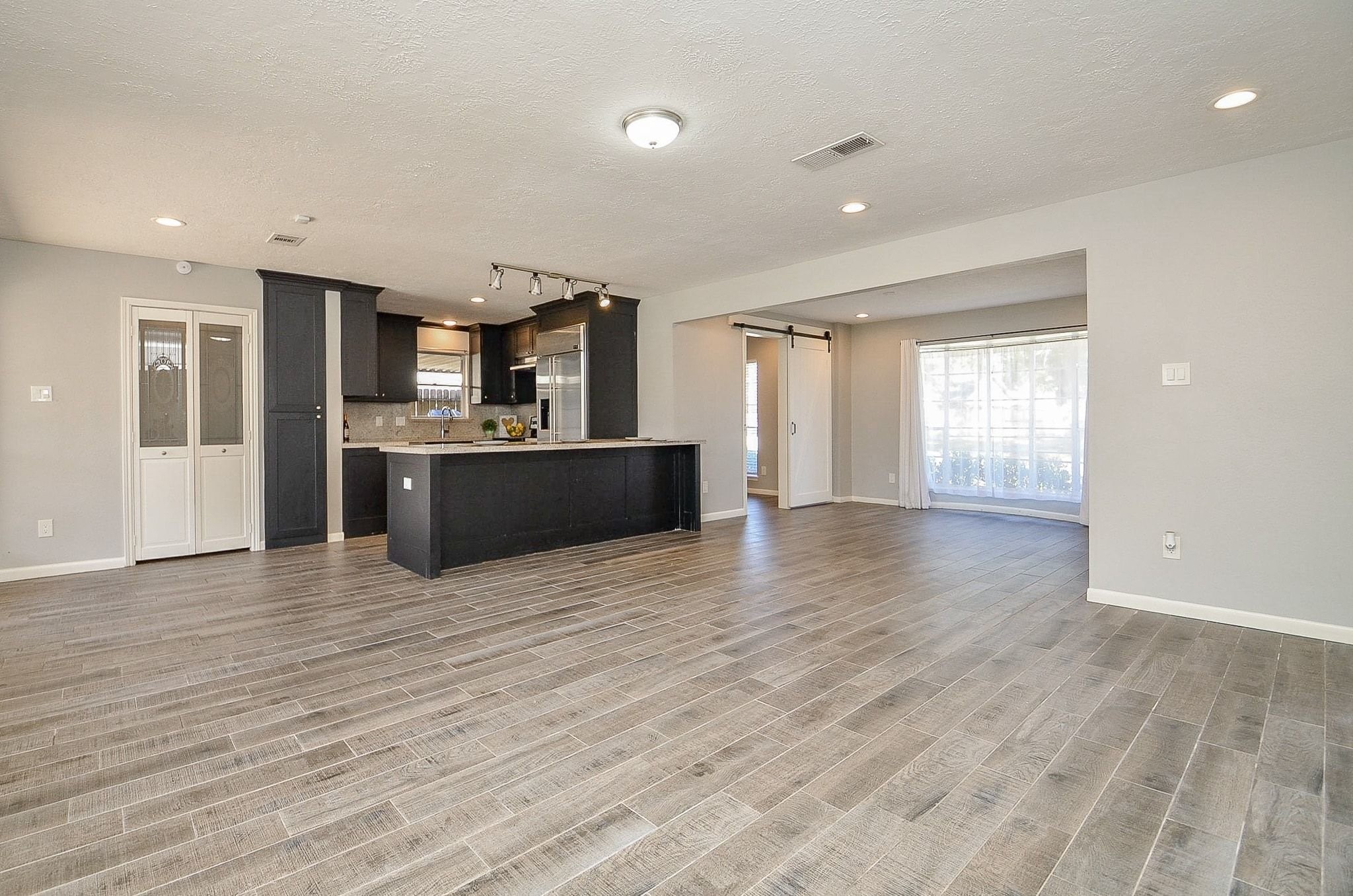 9215 Sharpcrest Street Houston, TX 77036 - Photo 31 of 31 a view of a kitchen with a sink and a refrigerator