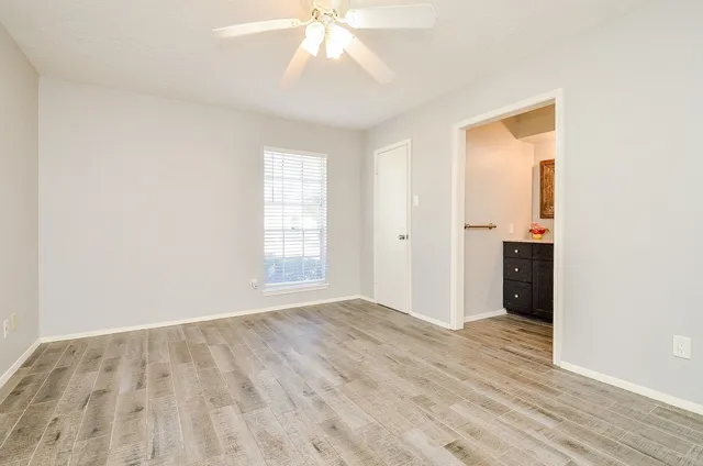 a kitchen with a sink and wooden cabinets