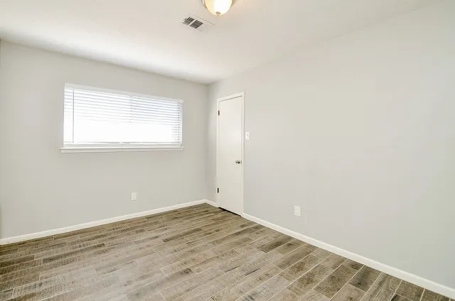 a bathroom with a sink vanity mirror and toilet
