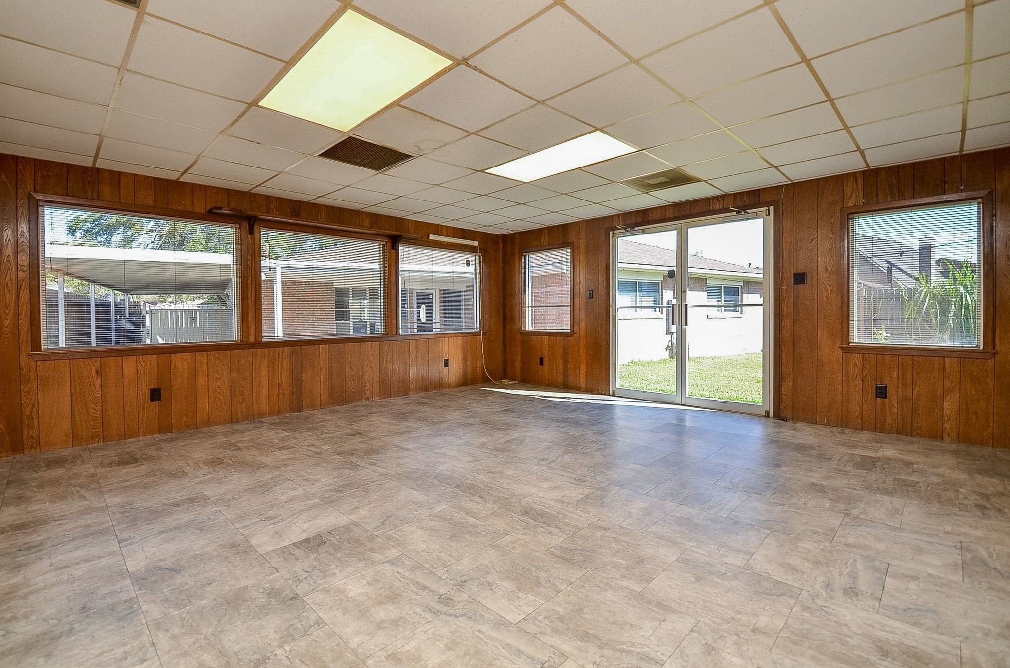 9215 Sharpcrest Street Houston, TX 77036 - Photo 23 of 31 an empty room with windows