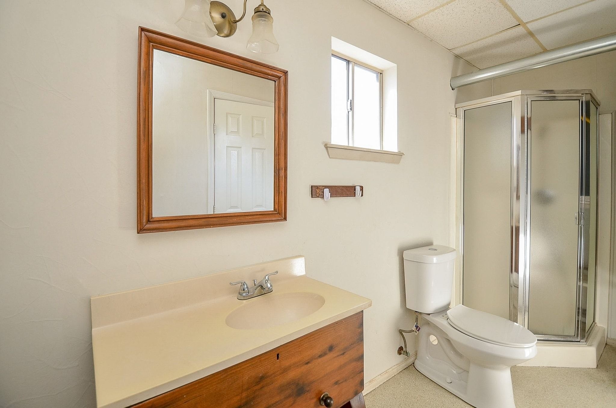 9215 Sharpcrest Street Houston, TX 77036 - Photo 25 of 31 a bathroom with a sink toilet and shower