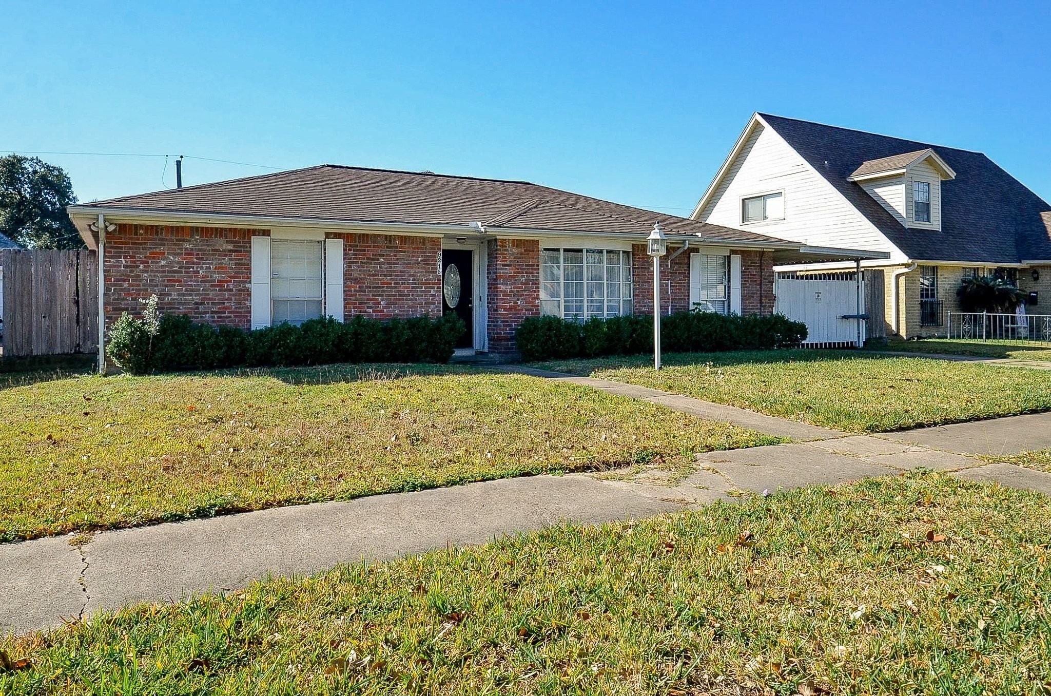 9215 Sharpcrest Street Houston, TX 77036 - Photo 29 of 31 a view of a yard in front of a house