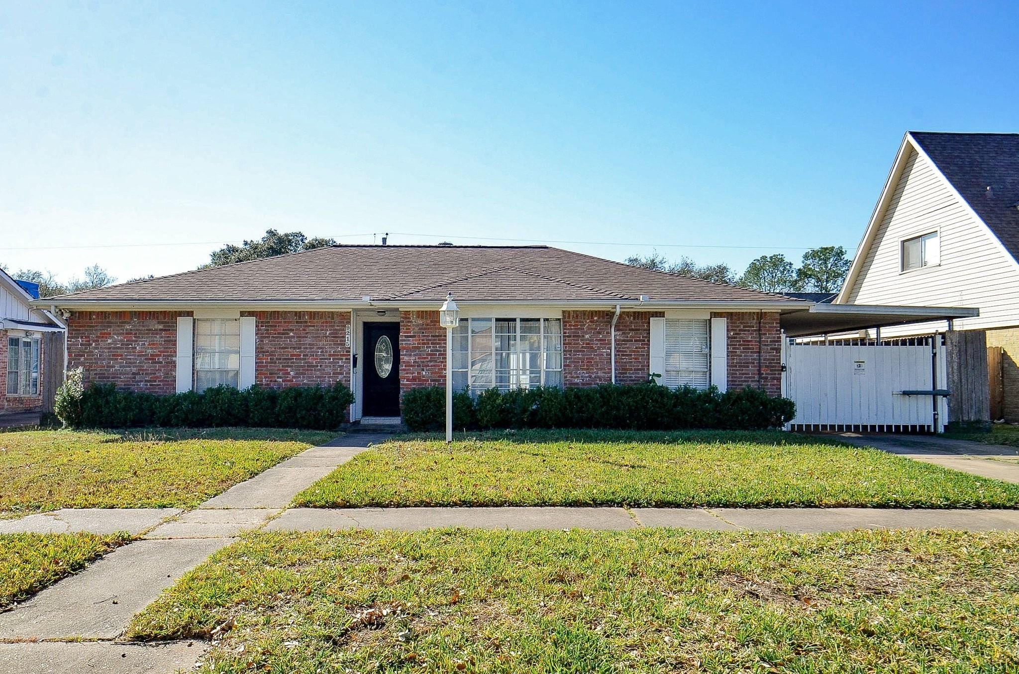 9215 Sharpcrest Street Houston, TX 77036 - Photo 30 of 31 a front view of a house with a yard and garage
