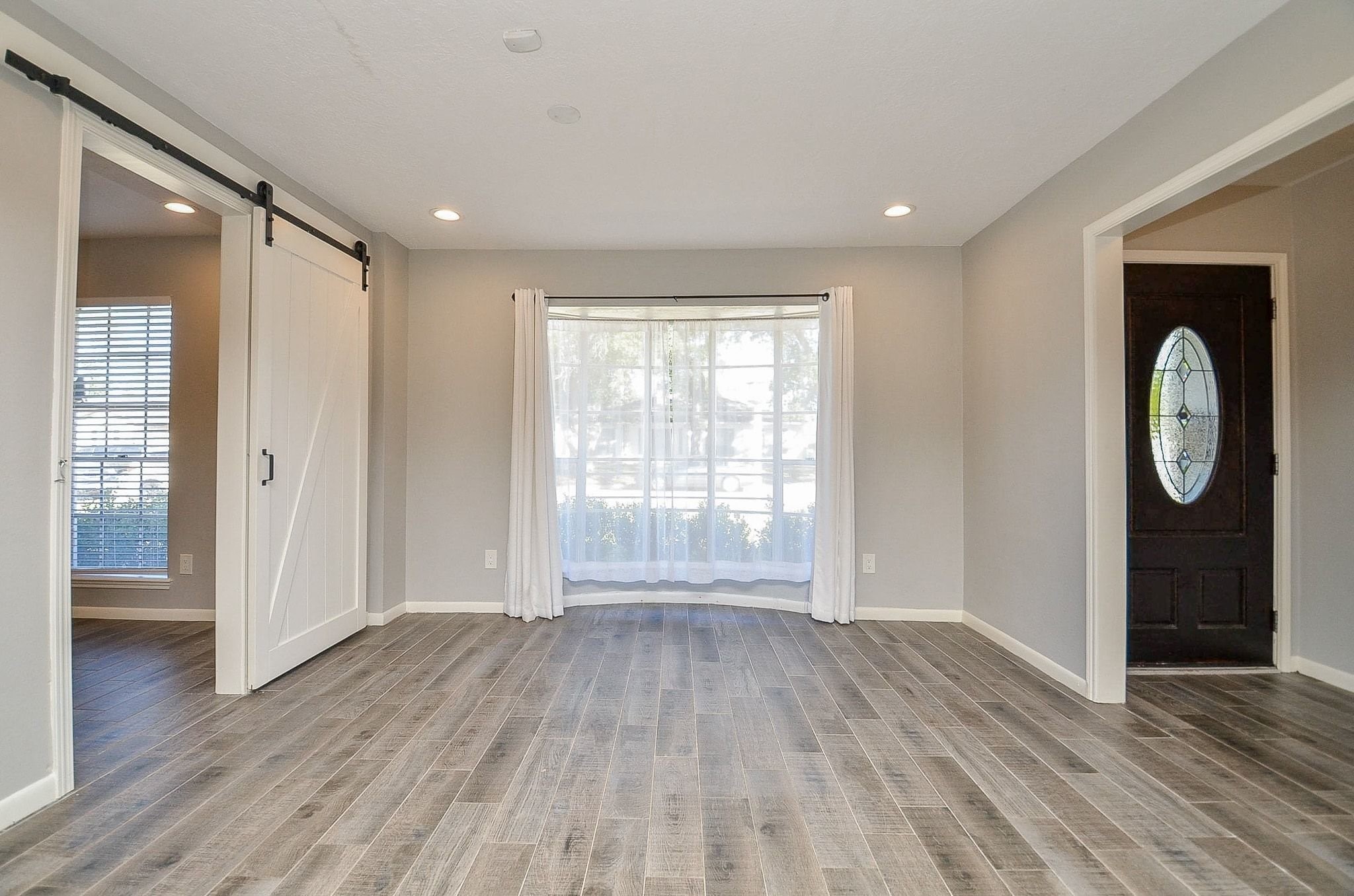 9215 Sharpcrest Street Houston, TX 77036 - Photo 5 of 31 a view of entryway with wooden floor