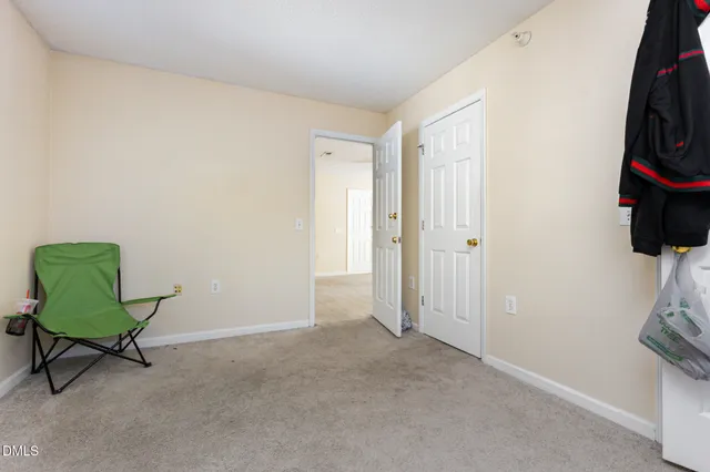 a living room with furniture and a closet