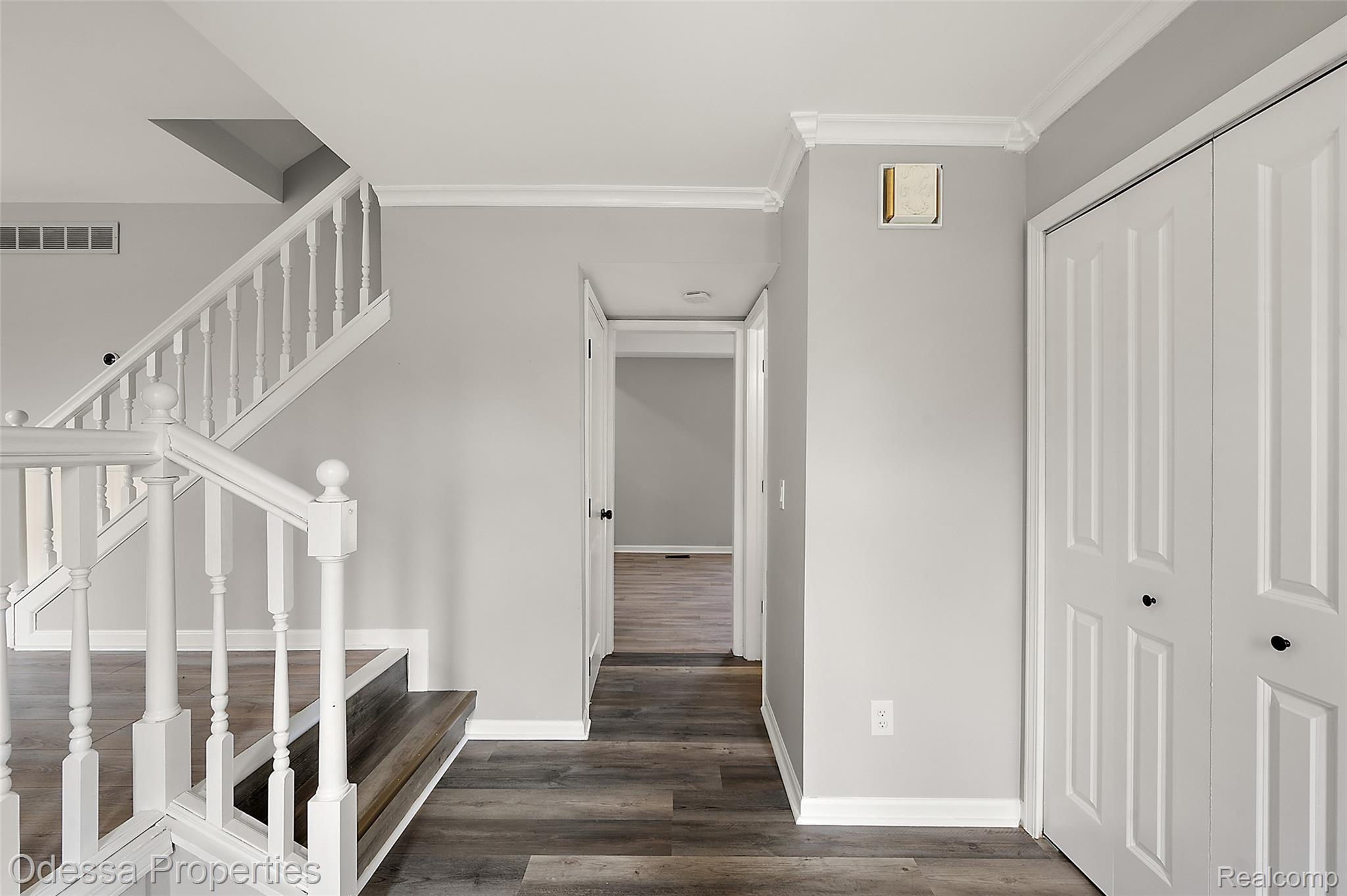 1442 Riley Center Road Memphis, MI 48041 - Photo 15 of 62 Stairway with wood finished floors and ornamental molding