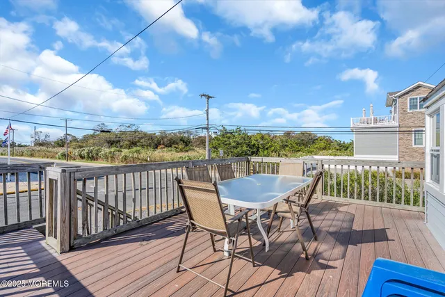 a view of a balcony with furniture