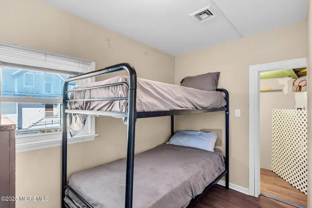 a bedroom with a bed and a table