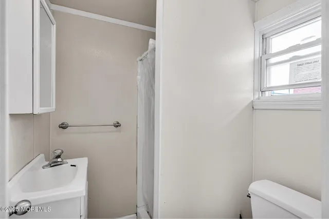 a bathroom with a bathtub and sink