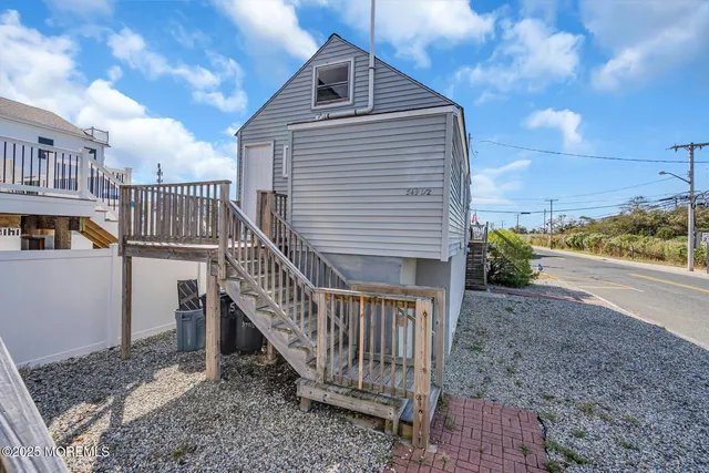 a view of a house with wooden stairs