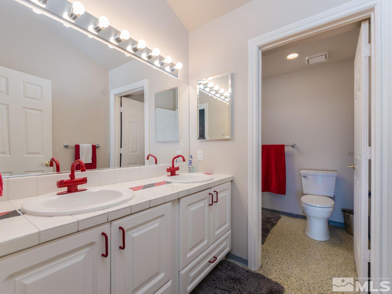 10315 Placerville Road Reno, NV 89508 - Photo 15 of 25 a bathroom with a sink and a mirror