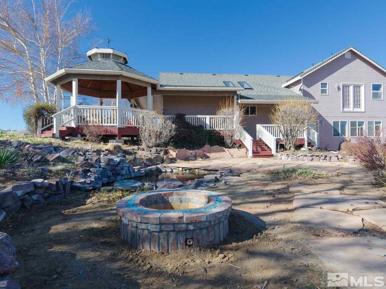 10315 Placerville Road Reno, NV 89508 - Photo 19 of 25 a view of a house with backyard and sitting area