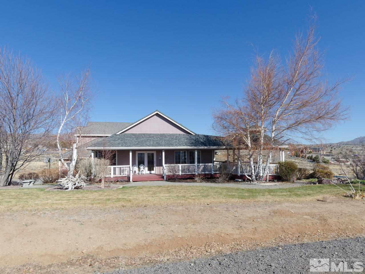 10315 Placerville Road Reno, NV 89508 - Photo 2 of 25 a front view of a house with a yard
