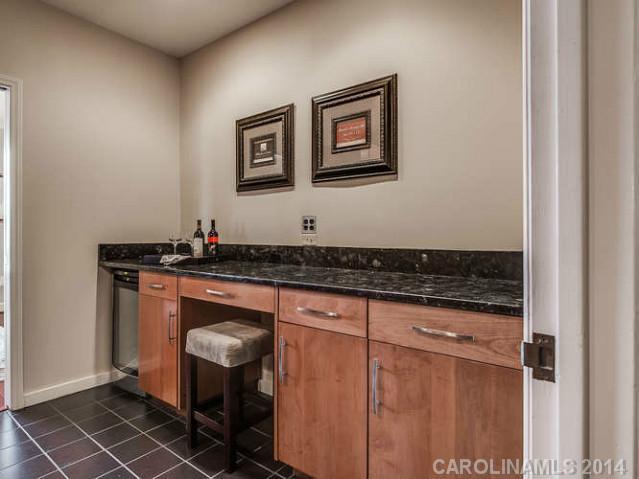 932 Cherokee Road, Unit 3D Charlotte, NC 28207 - Photo 4 of 16 a bathroom with a sink and a mirror