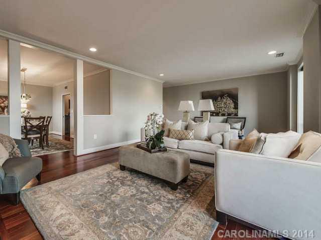 932 Cherokee Road, Unit 3D Charlotte, NC 28207 - Photo 7 of 16 a living room with furniture and wooden floor