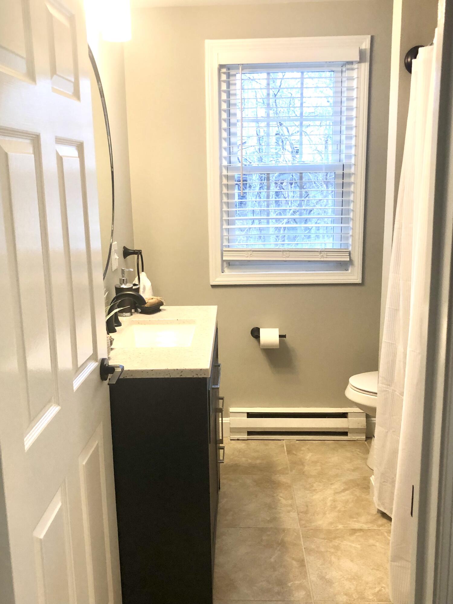 135 West Main Street, Unit 26 Hyannis, MA 02601 - Photo 20 of 29 a bathroom with a sink toilet and shower