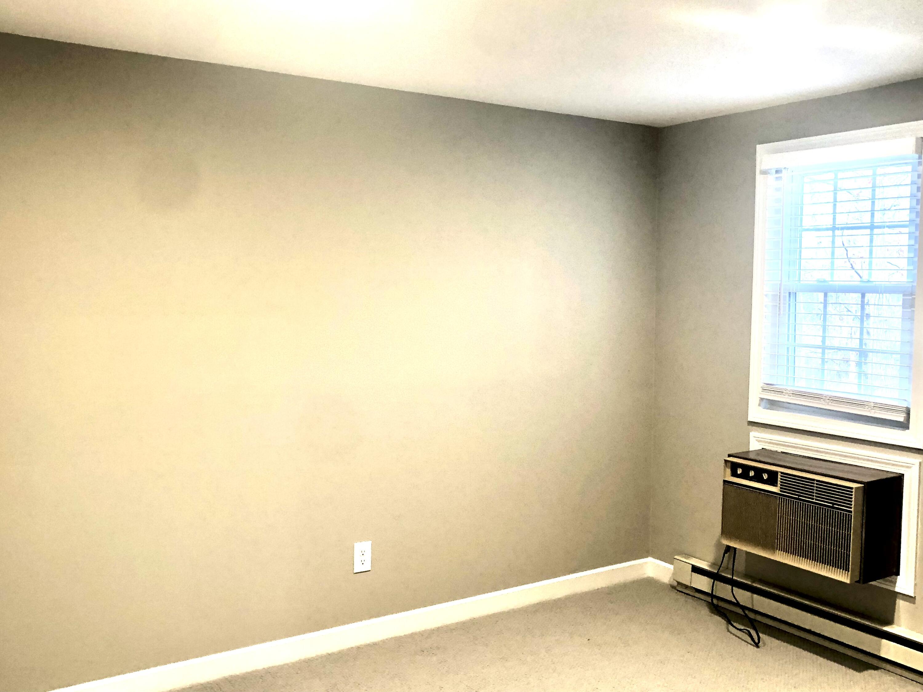135 West Main Street, Unit 26 Hyannis, MA 02601 - Photo 24 of 29 a view of a room with wooden floor and a fireplace