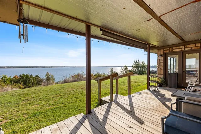 a view of a balcony with lake view and a ocean view