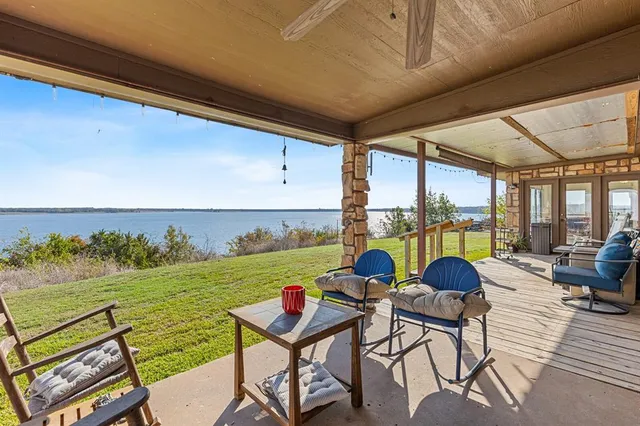 a view of swimming pool with outdoor seating