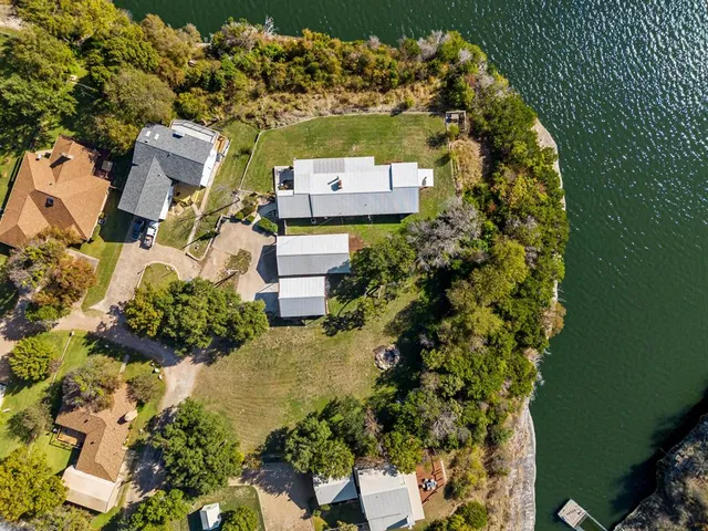 an aerial view of a house with a yard