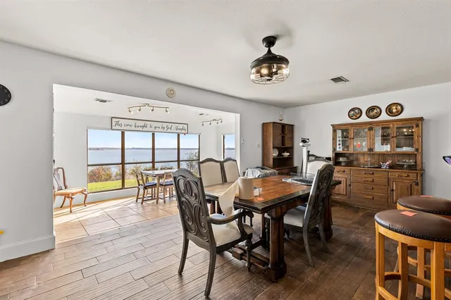 a view of a dining room with furniture window and outside view