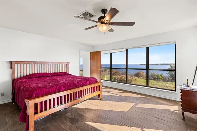 a bedroom with a bed and window