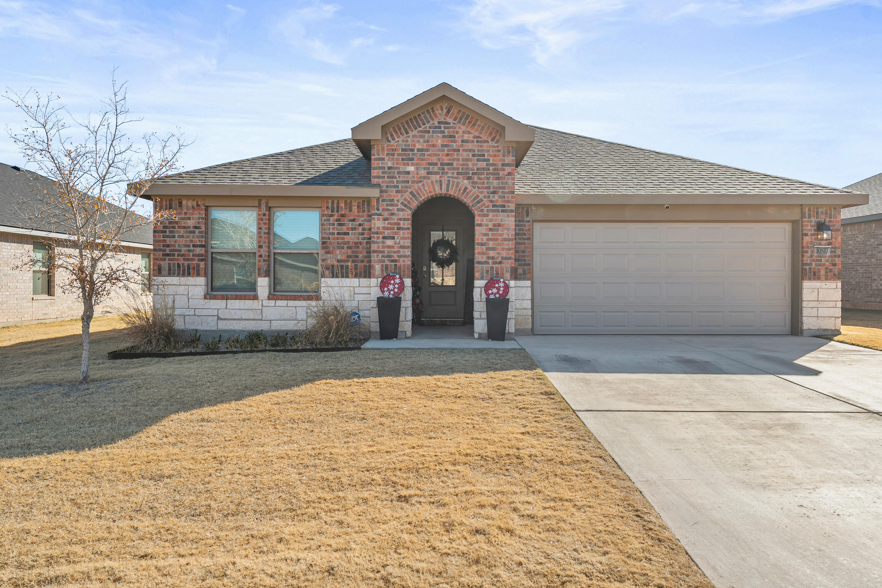 a front view of a house with yard