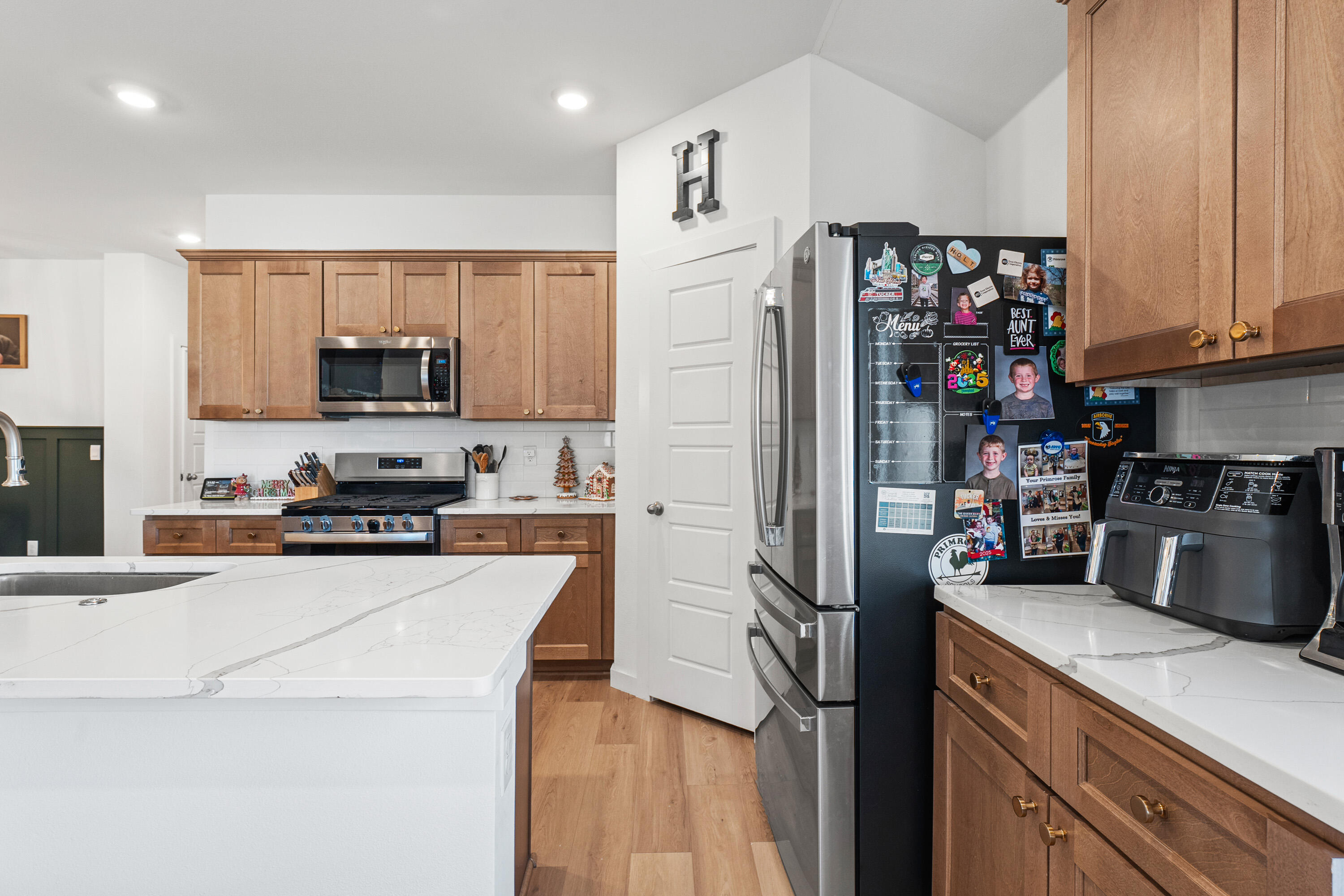 10517 Bangor Avenue Lubbock, TX 79424 - Photo 11 of 27 a kitchen with stainless steel appliances and a refrigerator