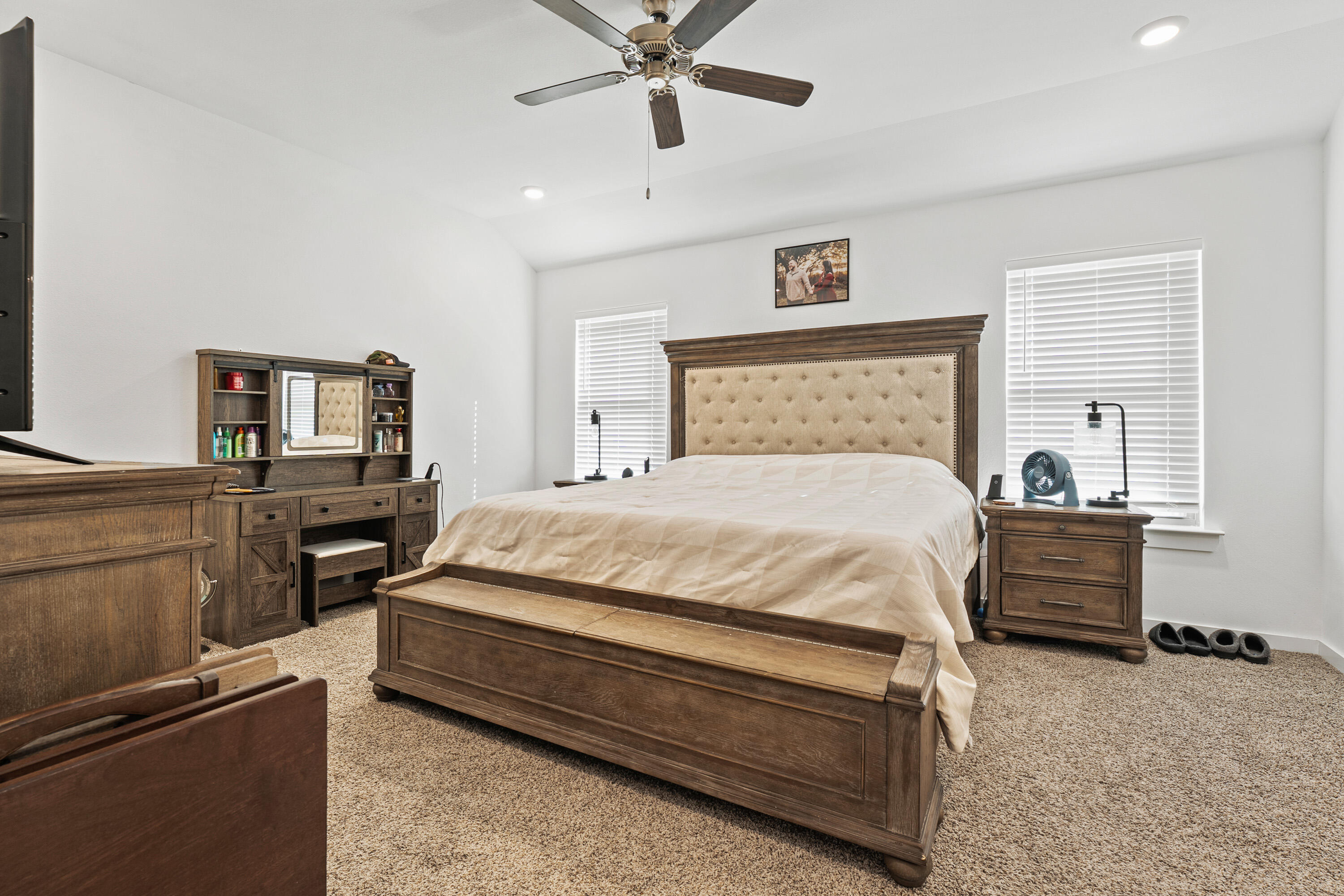 10517 Bangor Avenue Lubbock, TX 79424 - Photo 15 of 27 a bed room with a bed and dresser