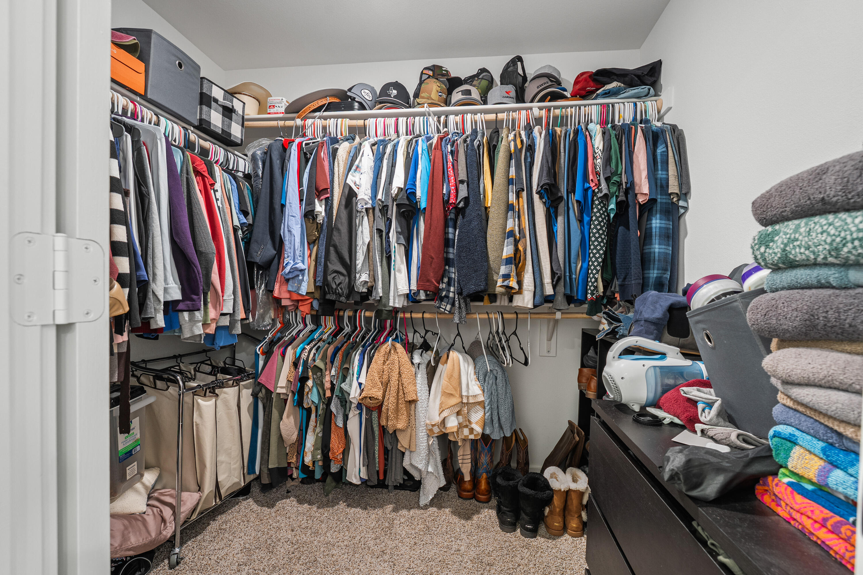 10517 Bangor Avenue Lubbock, TX 79424 - Photo 18 of 27 a view of walk in closet with clothes and shoes