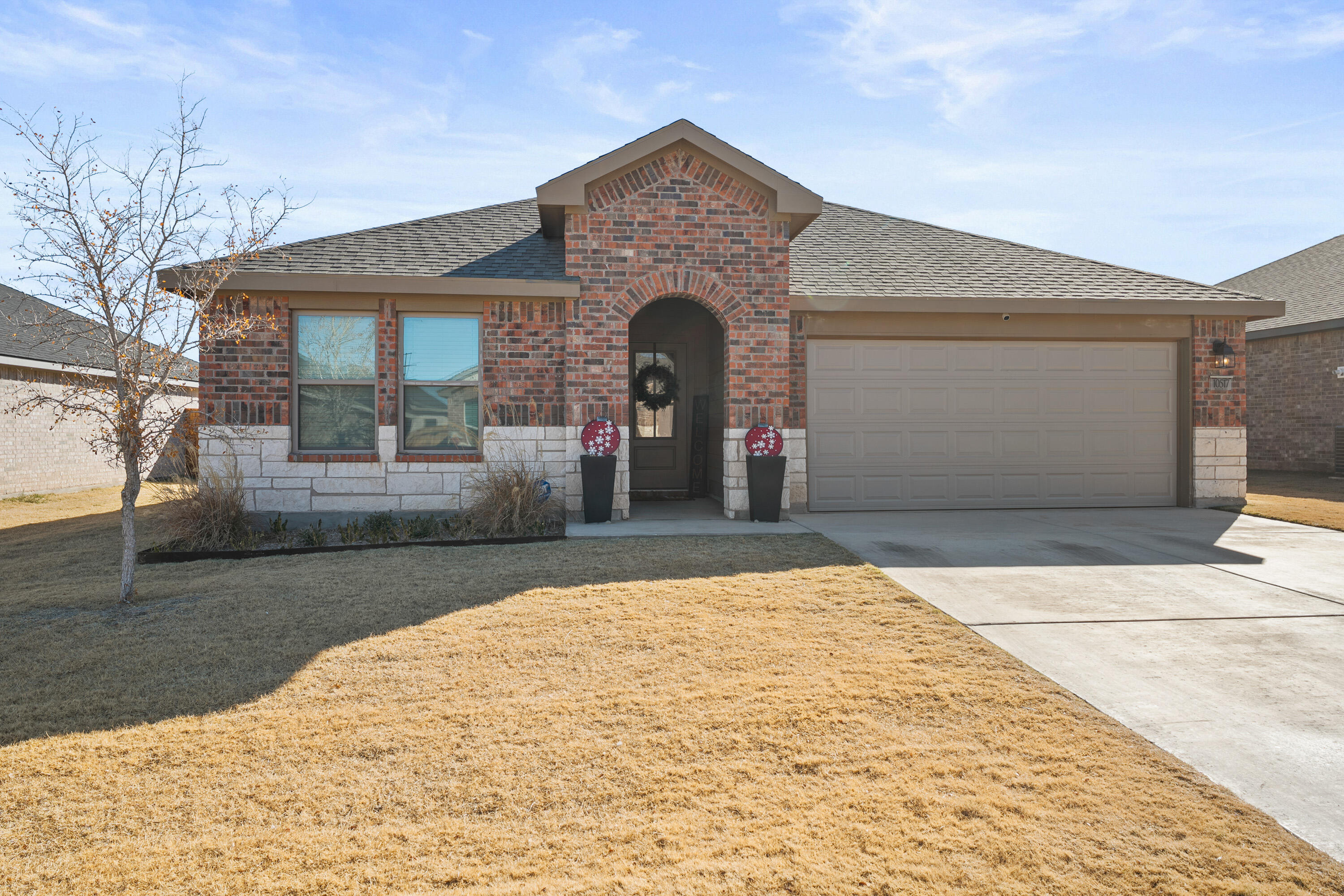 10517 Bangor Avenue Lubbock, TX 79424 - Photo 2 of 27 a front view of a house with yard