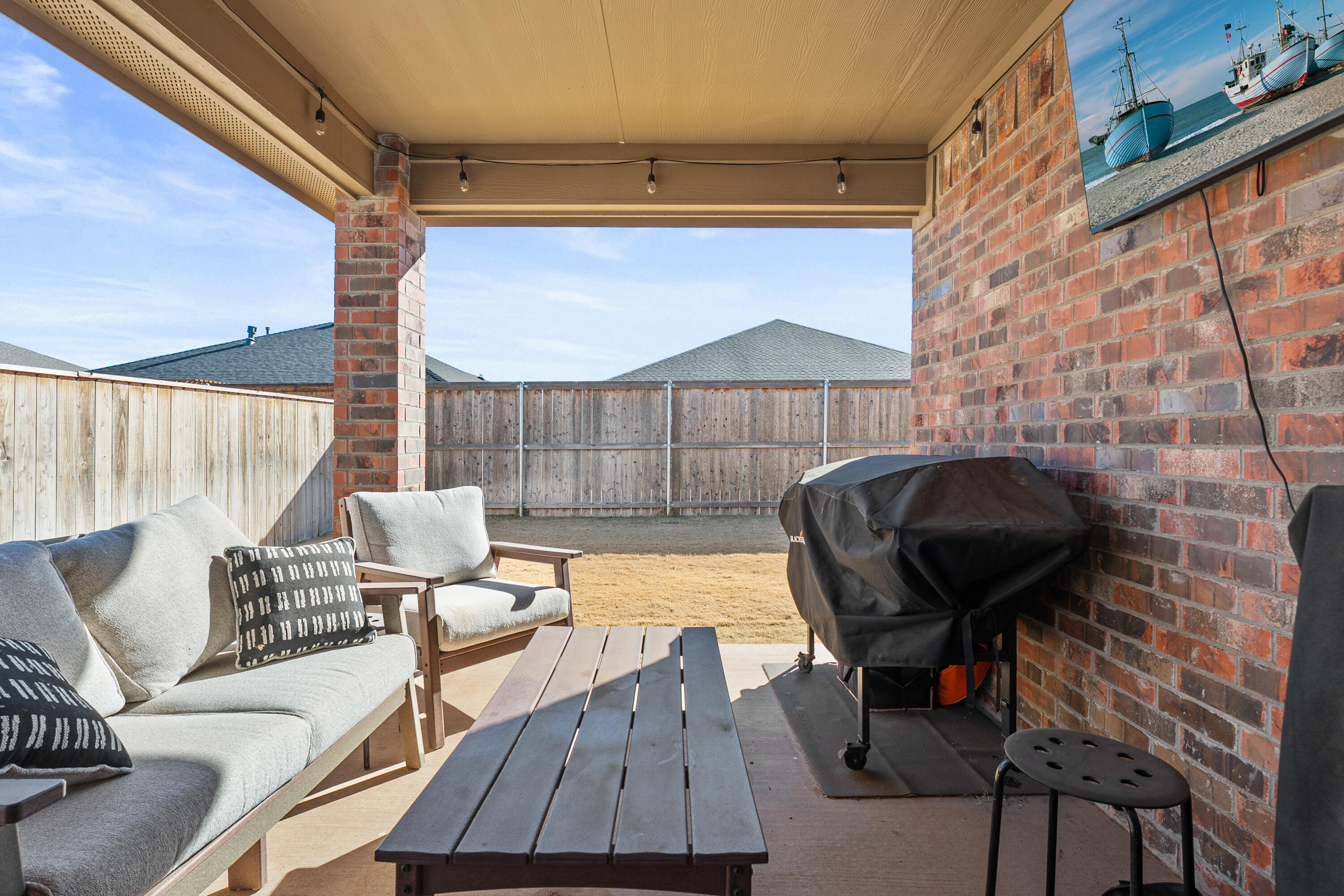 10517 Bangor Avenue Lubbock, TX 79424 - Photo 26 of 27 a sitting area with furniture and wooden floor