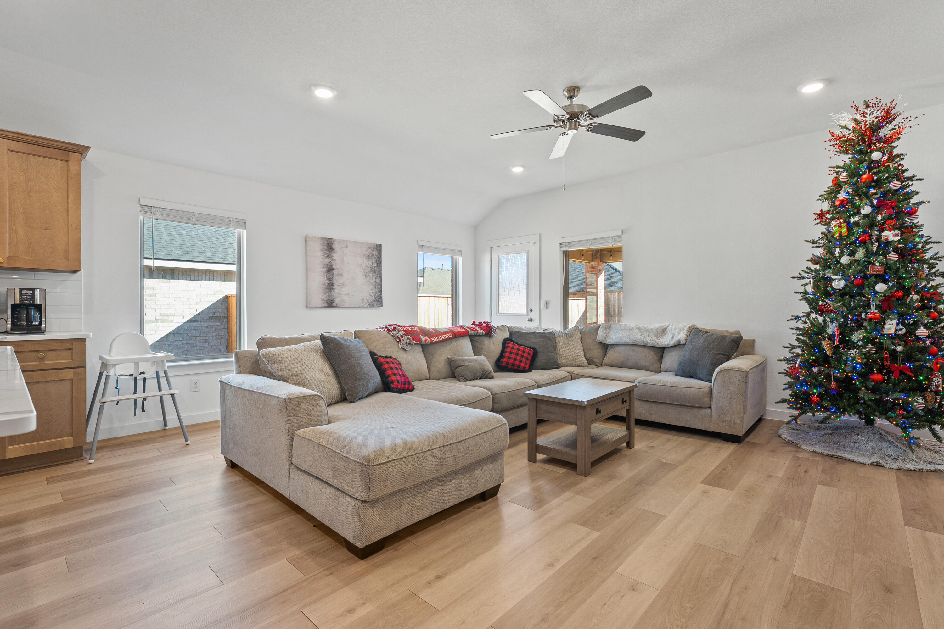 10517 Bangor Avenue Lubbock, TX 79424 - Photo 7 of 27 a living room with furniture and a chandelier