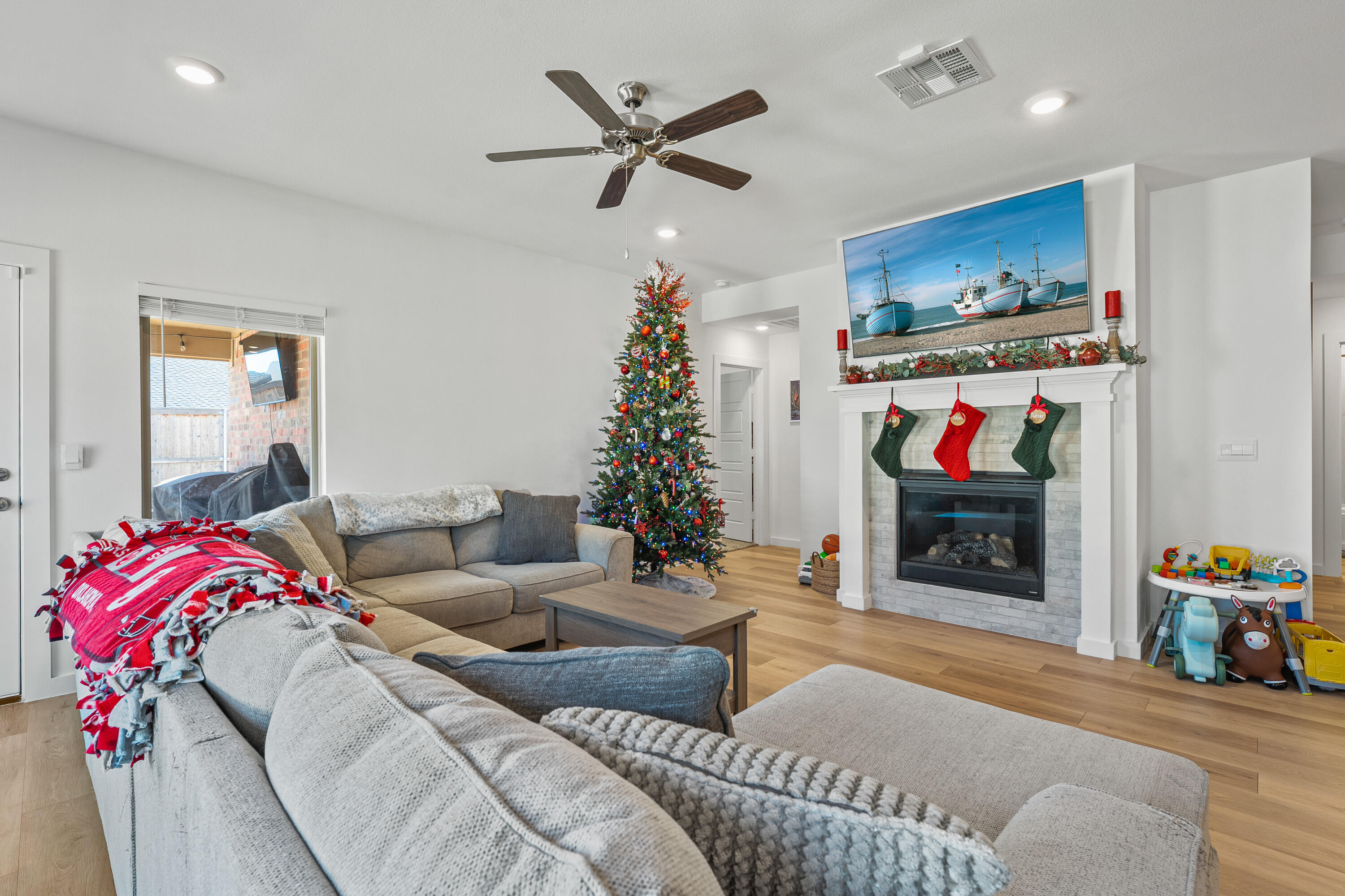10517 Bangor Avenue Lubbock, TX 79424 - Photo 8 of 27 a living room with furniture and a fireplace