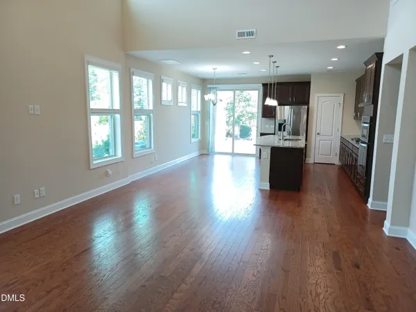 a view of kitchen with cabinets and wooden floor