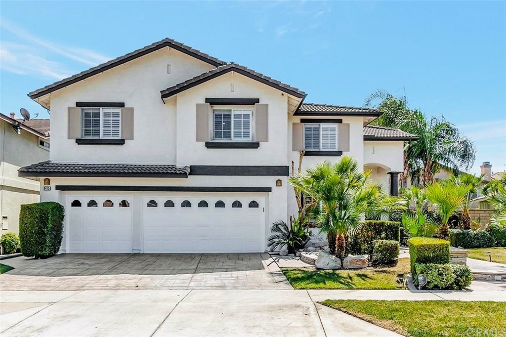 9415 Homestead Drive Rancho Cucamonga, CA 91730 - Photo 1 of 1 a front view of a house with garden