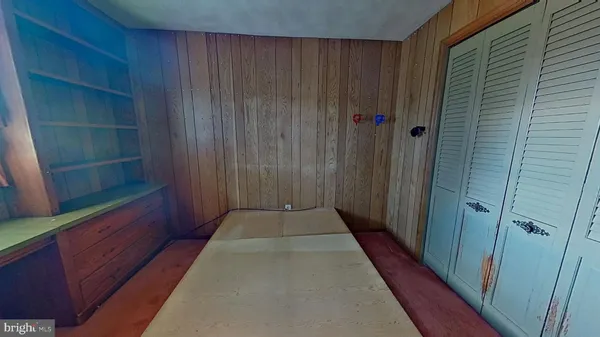 an empty room with furniture and windows